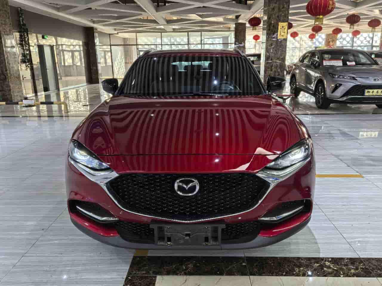 21 Мазда СХ-4 в синем небе стойкость издание